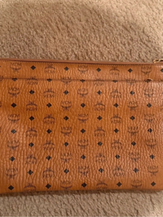MCM Handbags - MCM Cognac Monogram Leather Pouch with Black Logos
